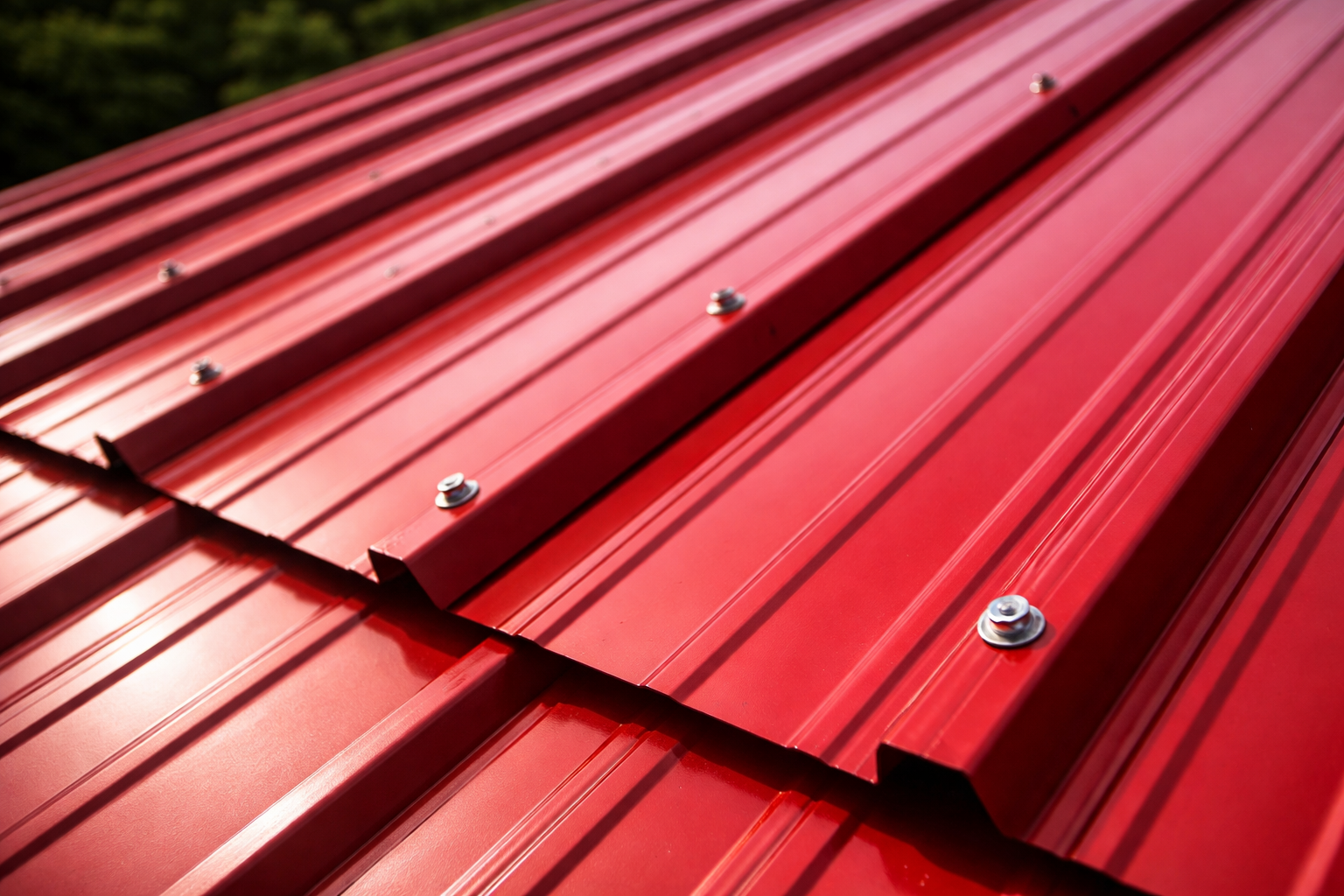 close-up of red tuff rib metal roofing panels with exposed fasteners
